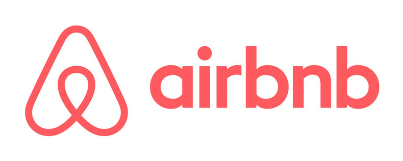 screenshot of the airbnb logo design (icon and wordmark) in plain, white background.