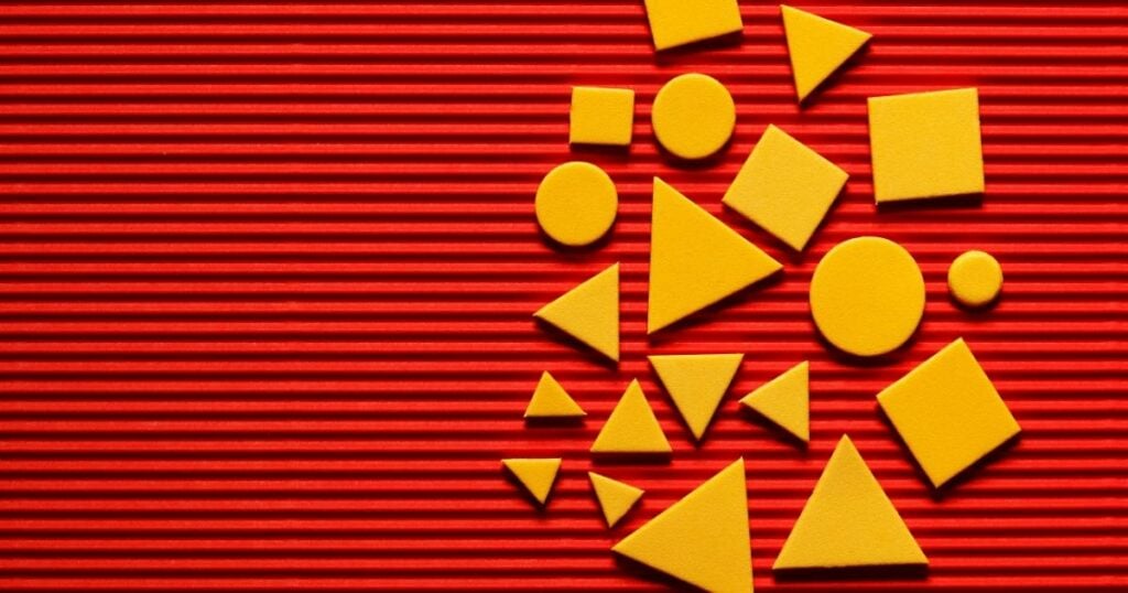 geometric shapes in yellow color and red background