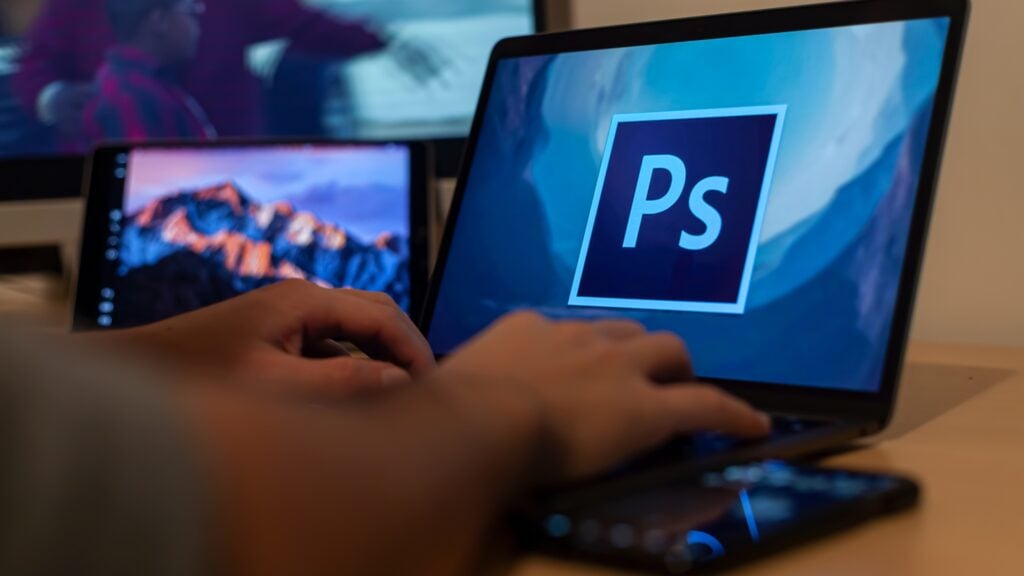 photoshop software as seen on the laptop monitor