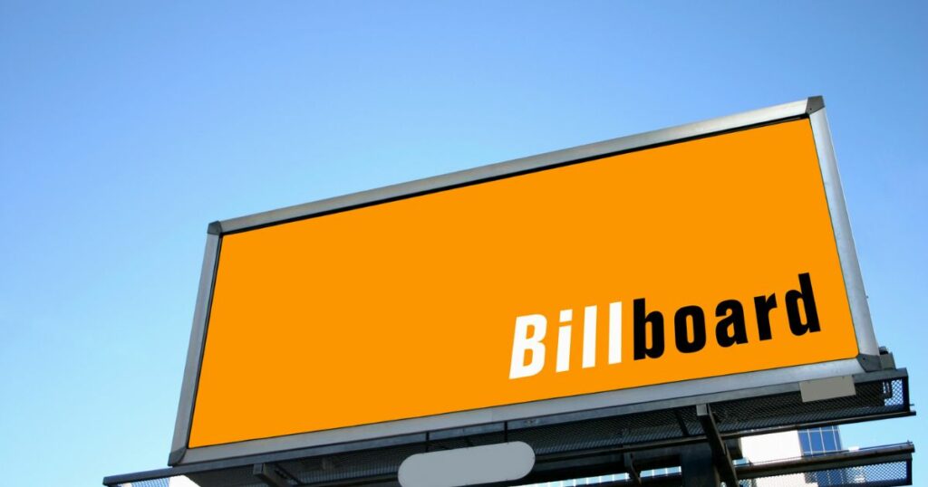 Sample billboard with the word written on it in a yellow orange backdrop