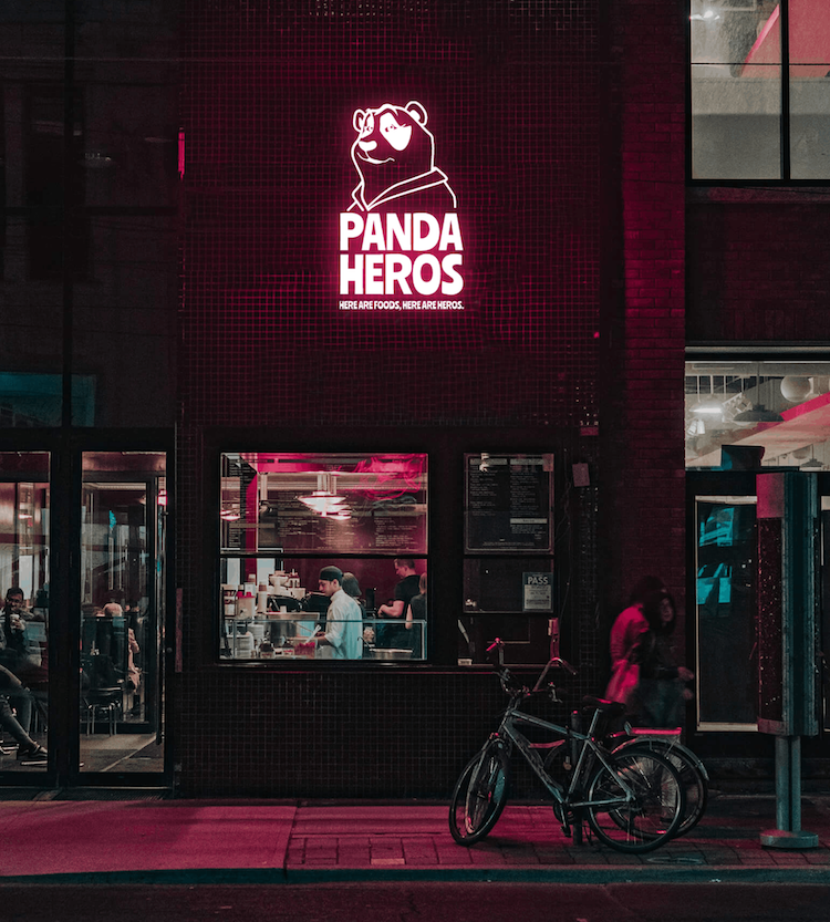 Pando Heros restaurant with an Illuminated  logo design as a front of its restaurant at night.