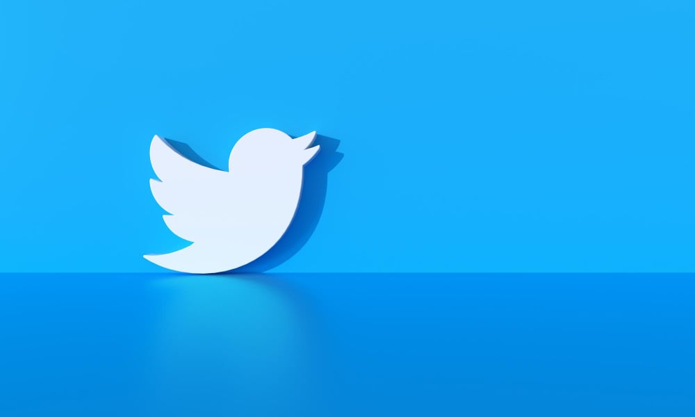 3d rendered of the twitter logo with shadow and blue background