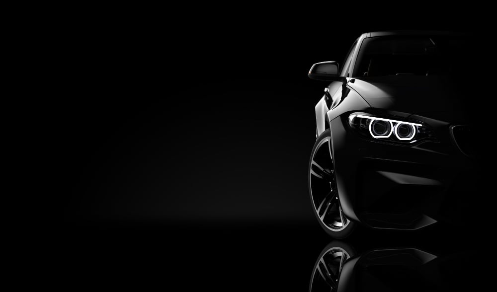 BMW new car model in the dark, showing only the single iconic front light