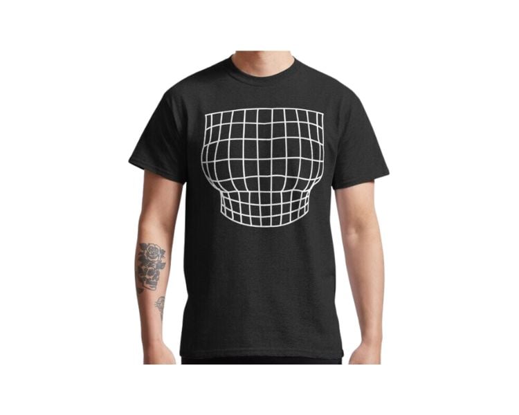 A male clothing model with a tattoo is wearing a black shirt with an optical illusion design.