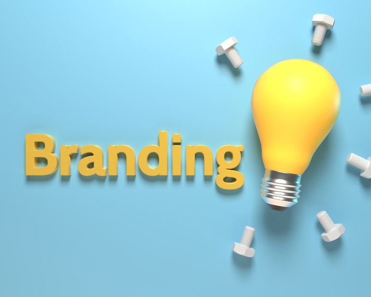 the word branding in yellow font with yellow light bulb on the right side