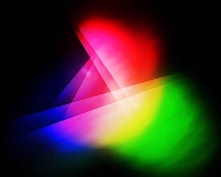 An art showcases the RGB or Red, Green, and Blue light in blurry effect against a black background.