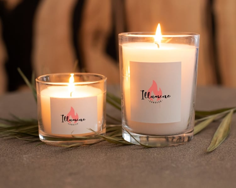 illumine candles logo design on 2 jars