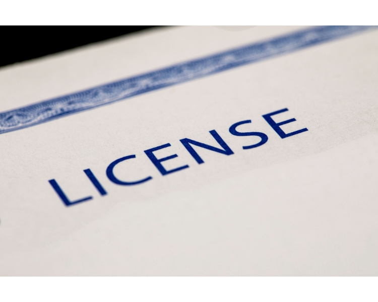 the word 'license' written on a piece of paper with a blue font