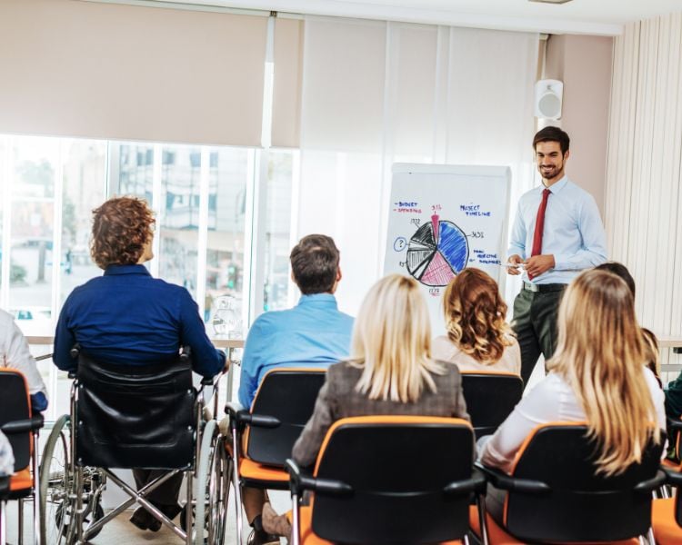 People in a meeting to present AI courses 