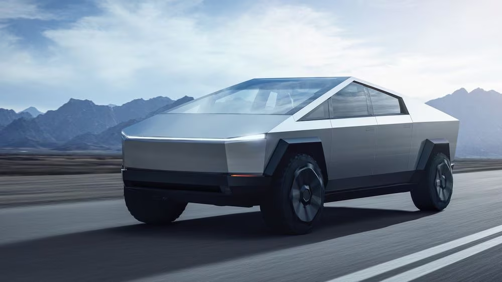 Tesla cybertruck with mountains in the background