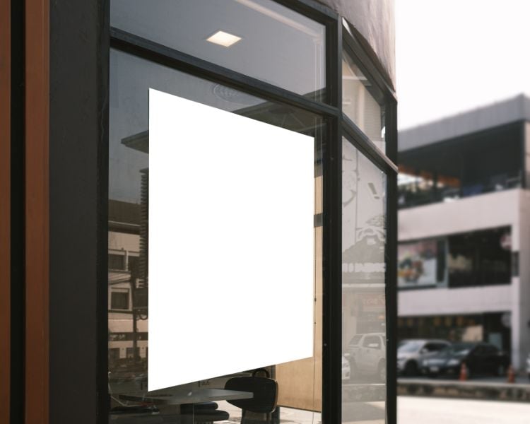 empty product posters in a glass wall