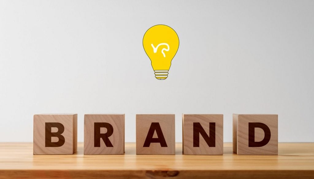 brand in wooden characters and a yellow bulb above