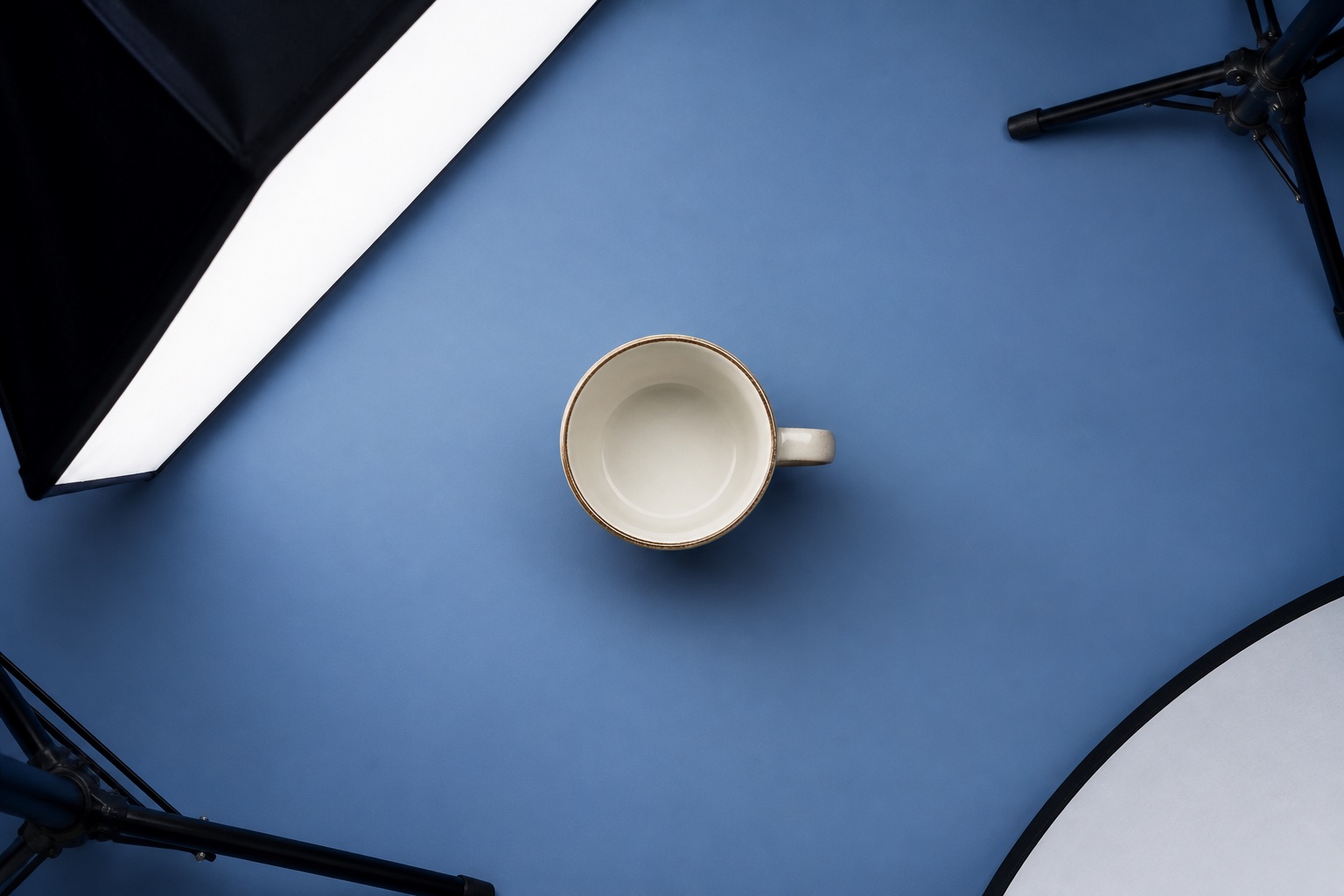 Ceramic mug photographed against a simple contrasting backdrop with soft studio lighting